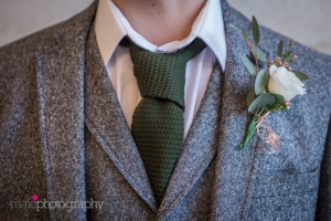 modern rustic wedding styling groom suit devon